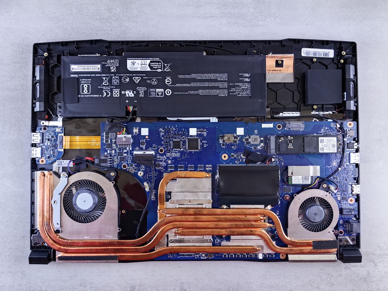 services-img Detailed view of laptop motherboard and cooling system components.